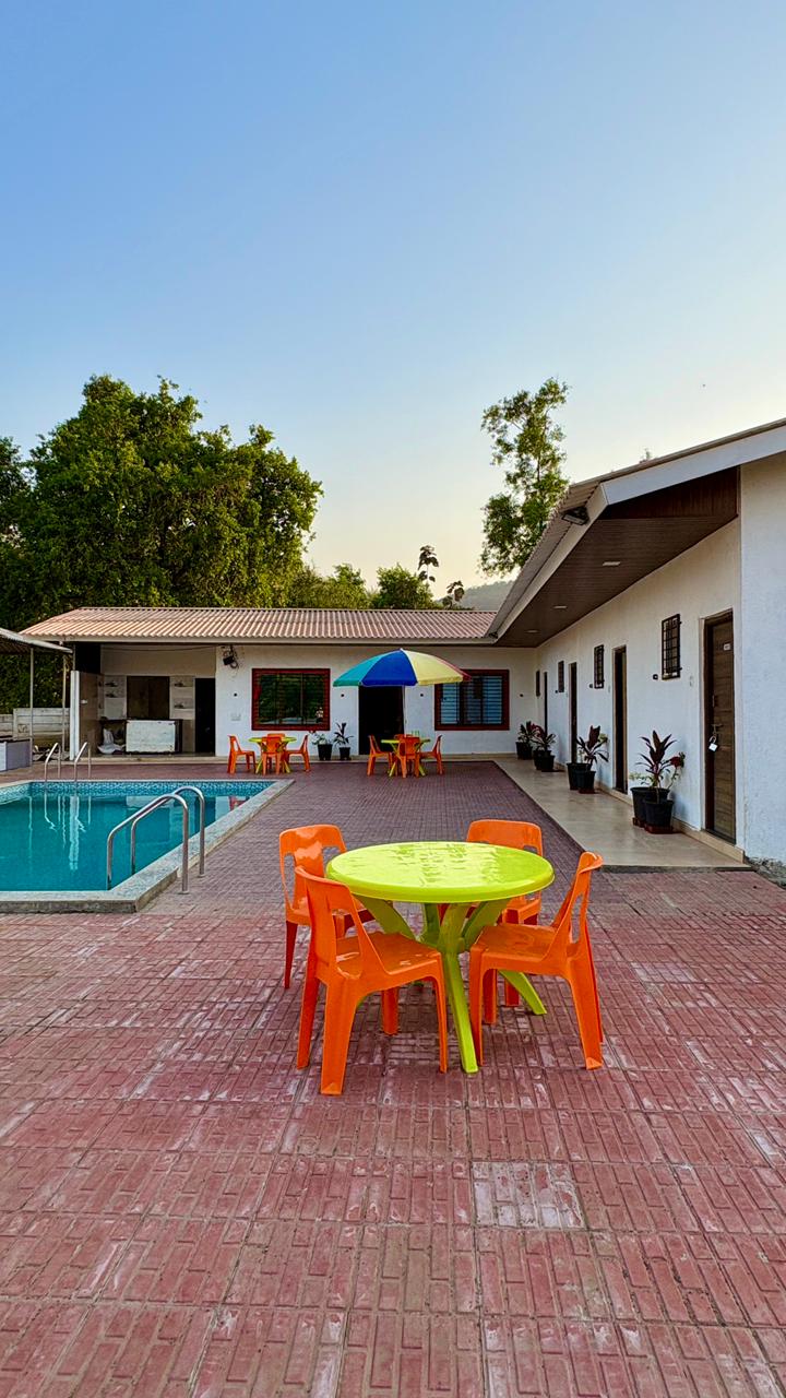 Poolside seating with umbrella