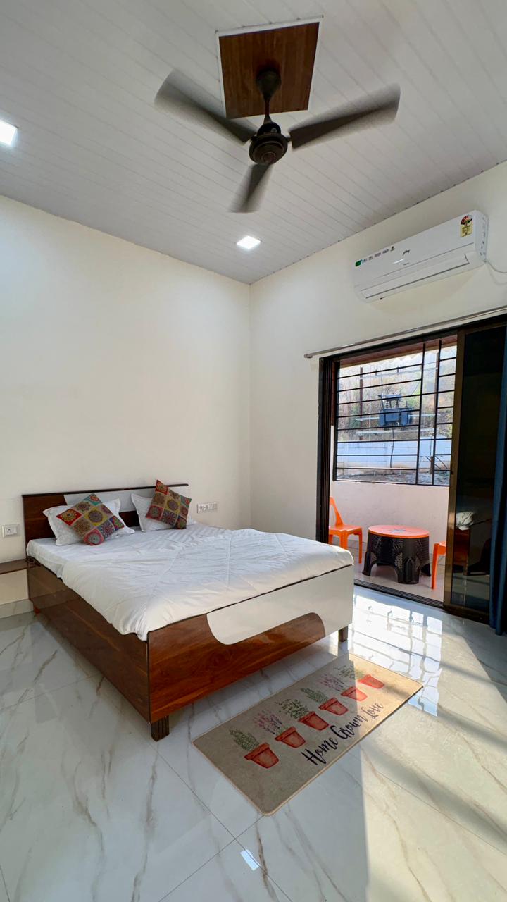 AC bedroom with balcony access